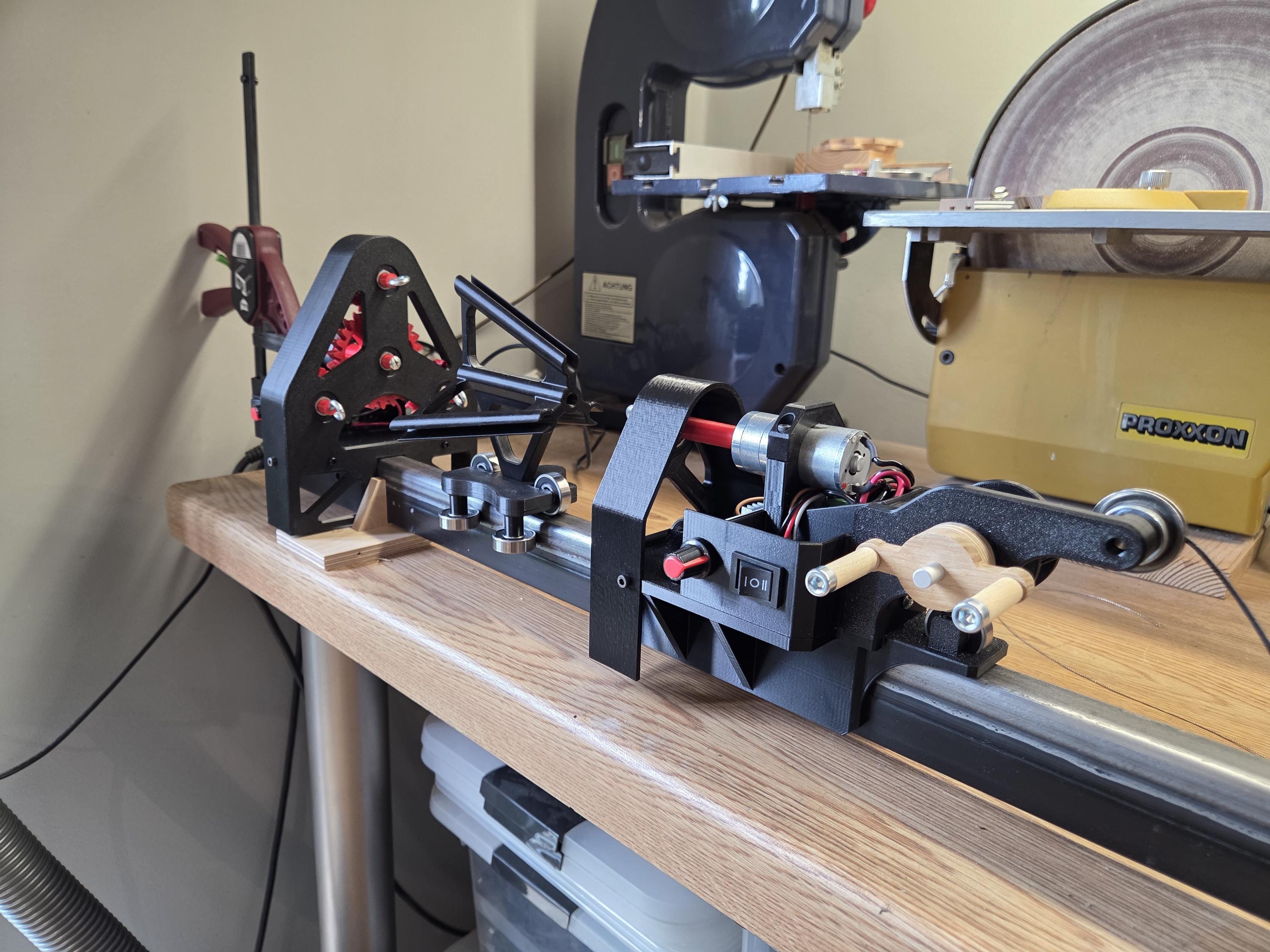 The RopeMaster 4000 set up on a workbench beside modelling tools