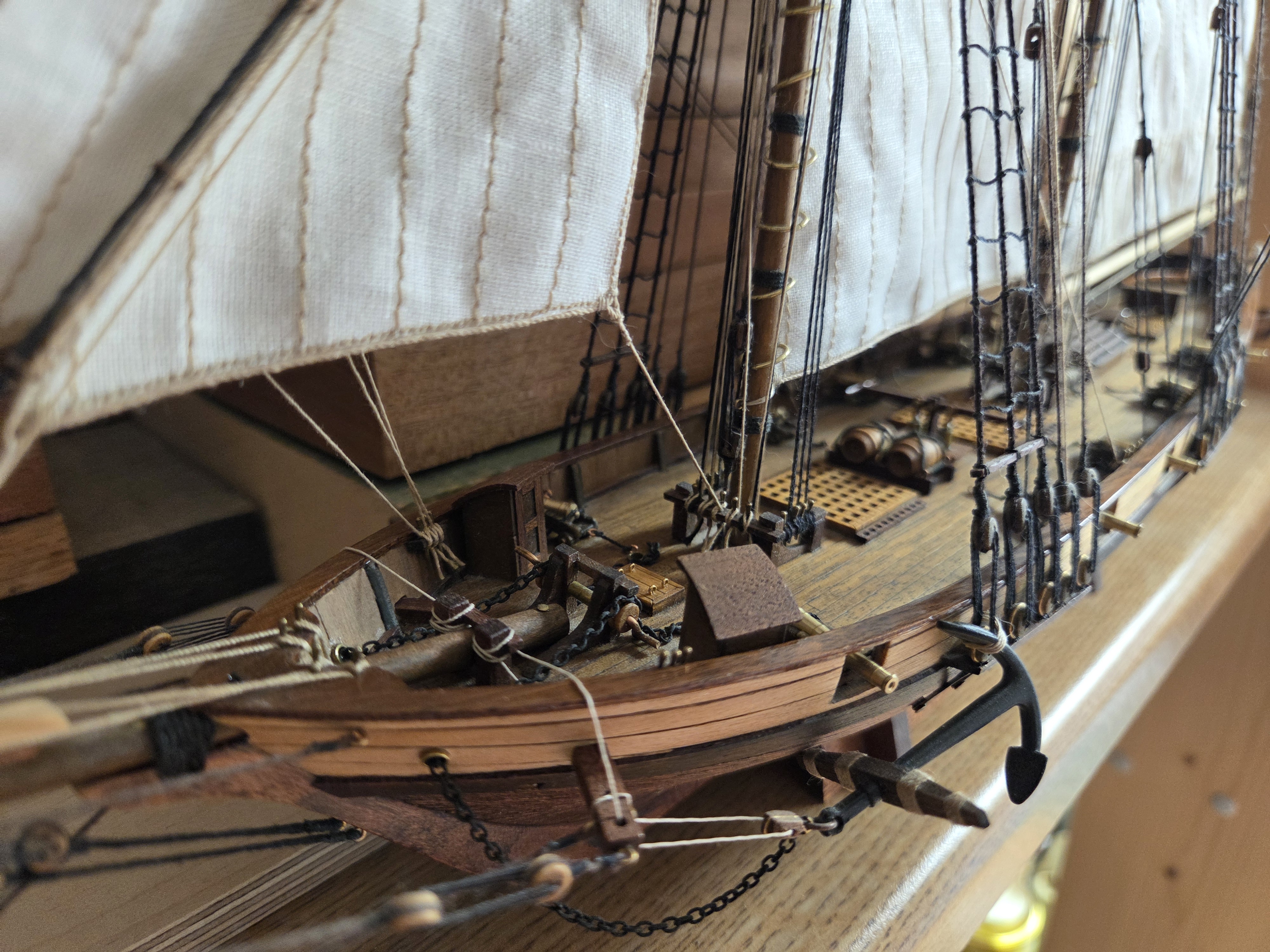 The Harvey under full sail with the anchor catted at the bow