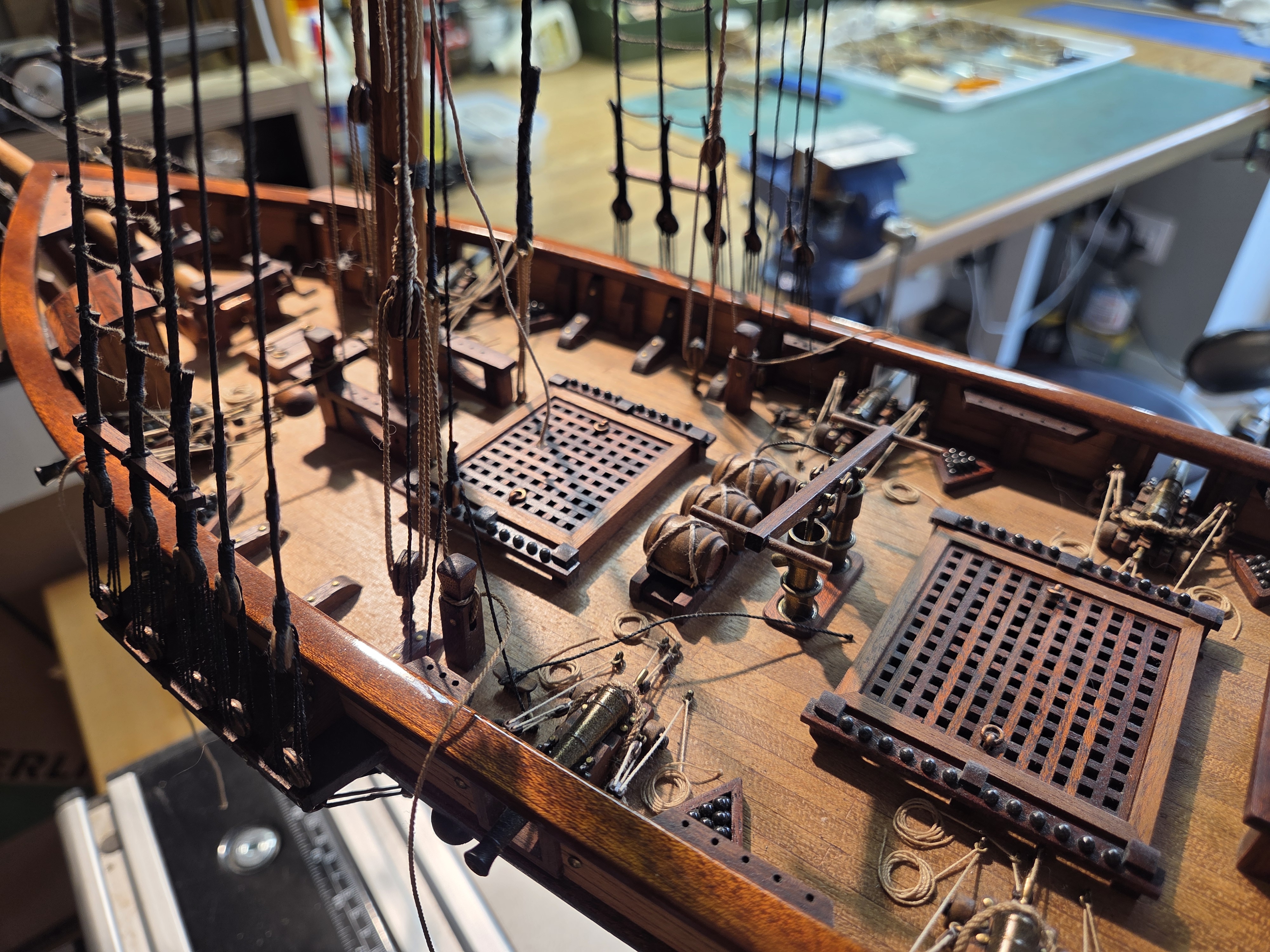 The Harvey's deck from above, showing gratings, guns and coiled rope